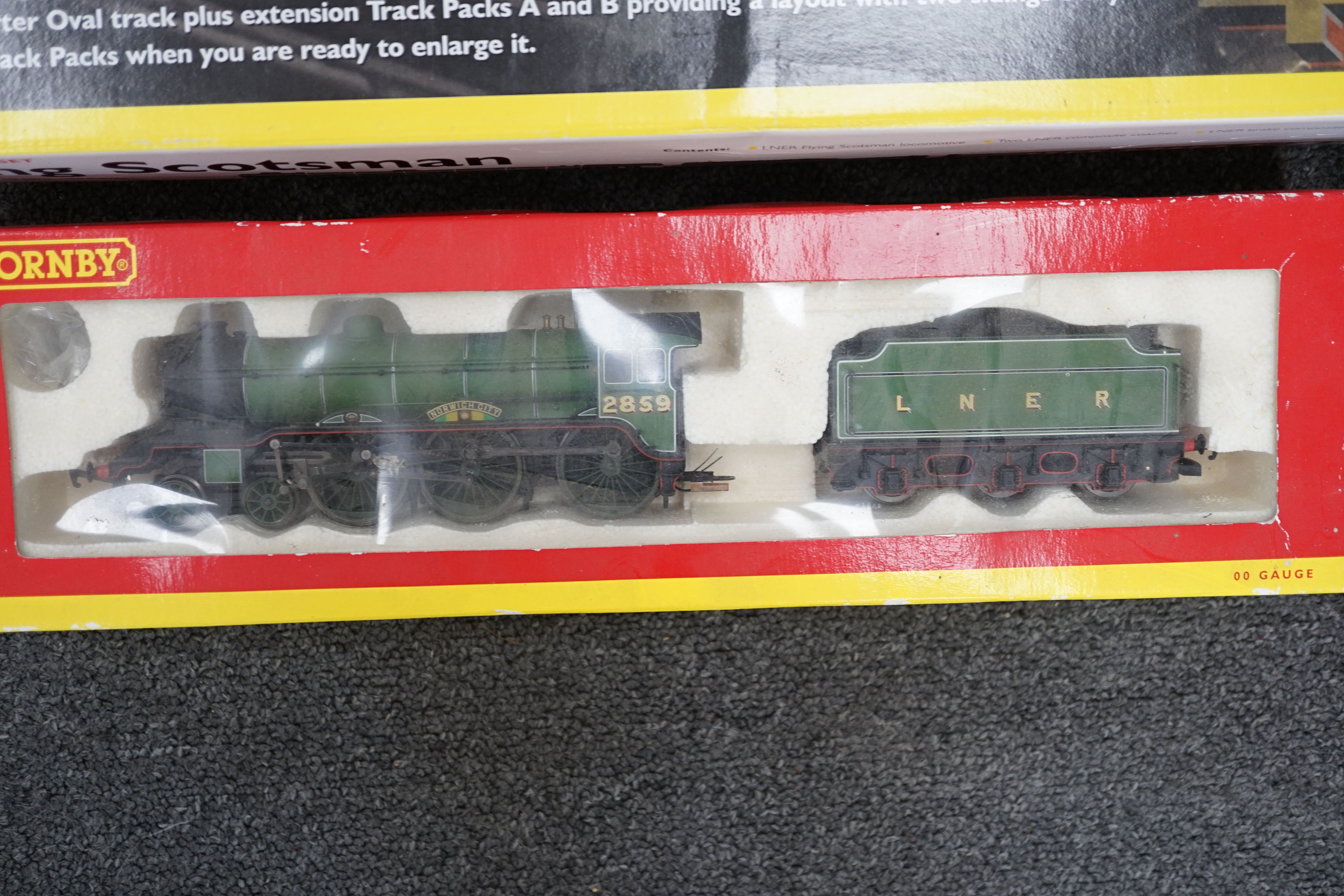 Nine Hornby 00 gauge LNER model railway items, including; a Flying Scotsman train set (R1019) comprising of Flying Scotsman and three teak coaches (missing some accessories and controllers), two additional tender locomot